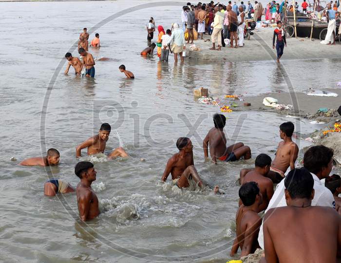 Hindu Devotees Takes Holy Dip In The Sangam, Confluence Of Three Rivers, The Ganga, The Yamuna And Mythical Saraswati After Lunar Eclipse Or Chandra Grahan In Prayagraj, June 6, 2020.