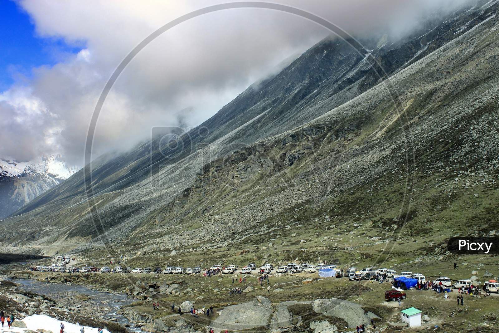 Huge Mountains of Sikkim with Vehicles in the foreground