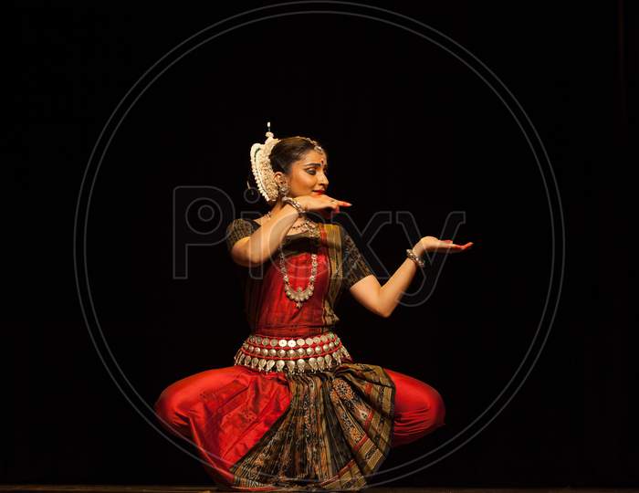 A highly talented junior Odissi dancer looks at the lord adoringly during the Odissi evening recital event on October 19,2018 at Bharatiya Vidhya Bhavan in Bengaluru,India