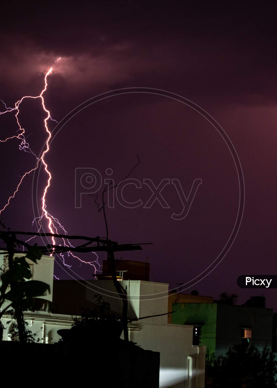 Lightning Storm Over The City Buildings. Lightning Bolt Strike During A Thunderstorm On Metropolitan City. Dark Sky With Bright Electrical Flash, Thunder And Thunderbolt, Bad Weather Concept