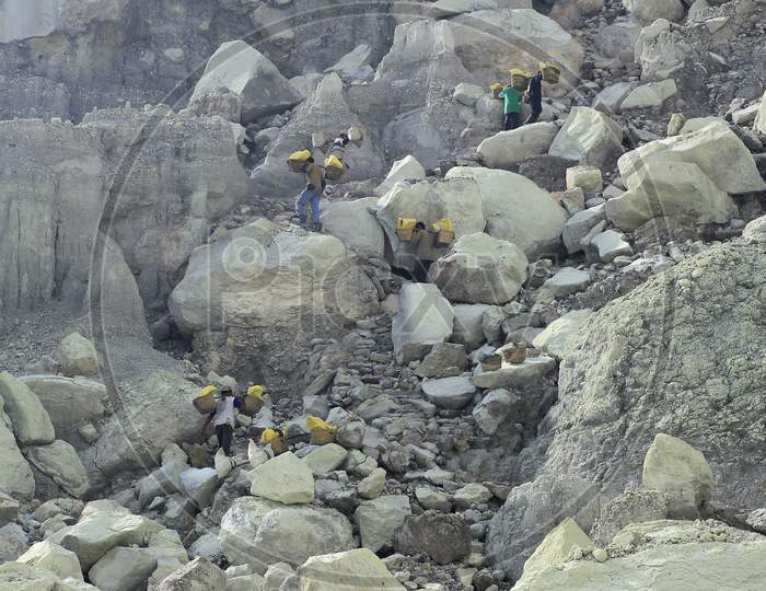Sulfur miners in the ijen crater