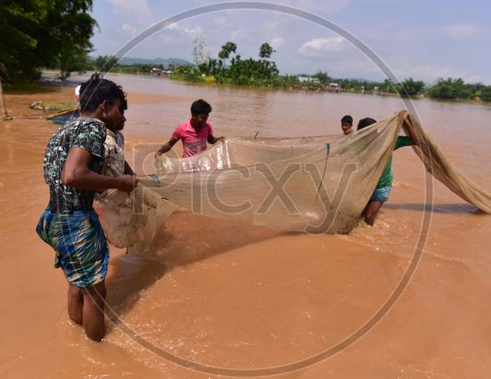 Villagers  Fishing On Flood Water At  Pramila Village Near Kampur In Nagaon District Of Assam On June 7,2020.