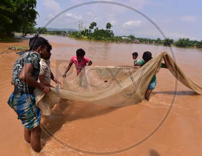 Villages fish in Flood Waters At  Pramila Village Near Kampur In Nagaon District Of Assam On June 7,2020