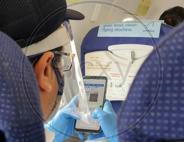 6Th June 2020- Netaji Subhas Chandra Bose International Airport, Calcutta, India-Traveller In Protective Gear Inside An Indigo Flight As Flight Services Resume Post Lockdown In India