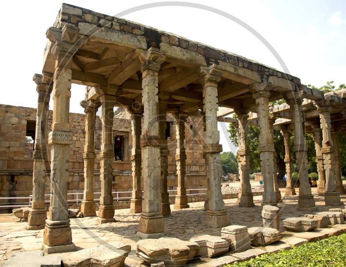 Ruins Of A Temple At The Qutub Complex In India, Stone Columns And Roof Still Standing