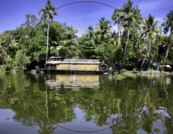 A Houseboat Gently Floating In A State Named Kerala, In India