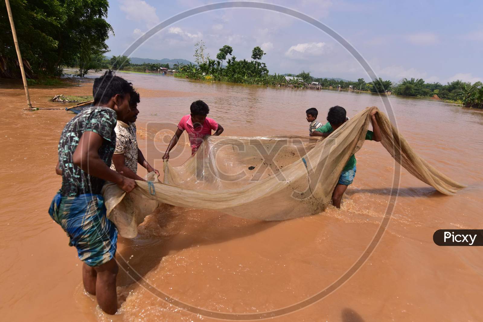 Villages fish in Flood Waters At  Pramila Village Near Kampur In Nagaon District Of Assam On June 7,2020