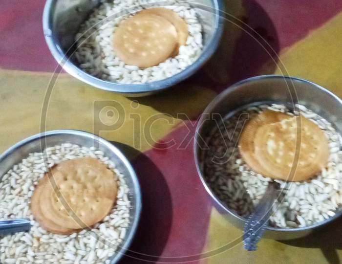 Indian breakfast, tea biscuits fridge rice mudi