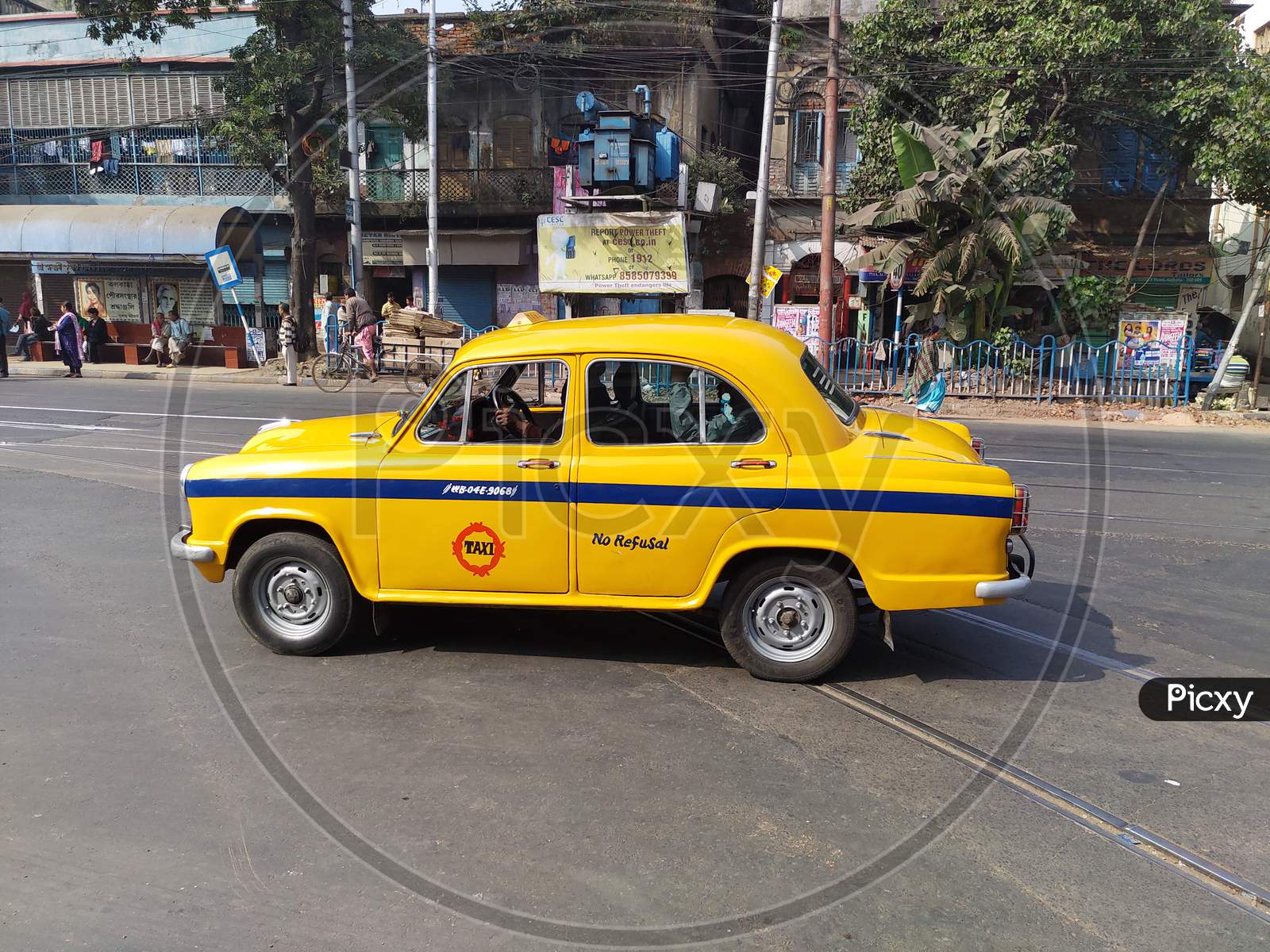 Kolkata, JAN-28 : a yellow colour taxi on the road.