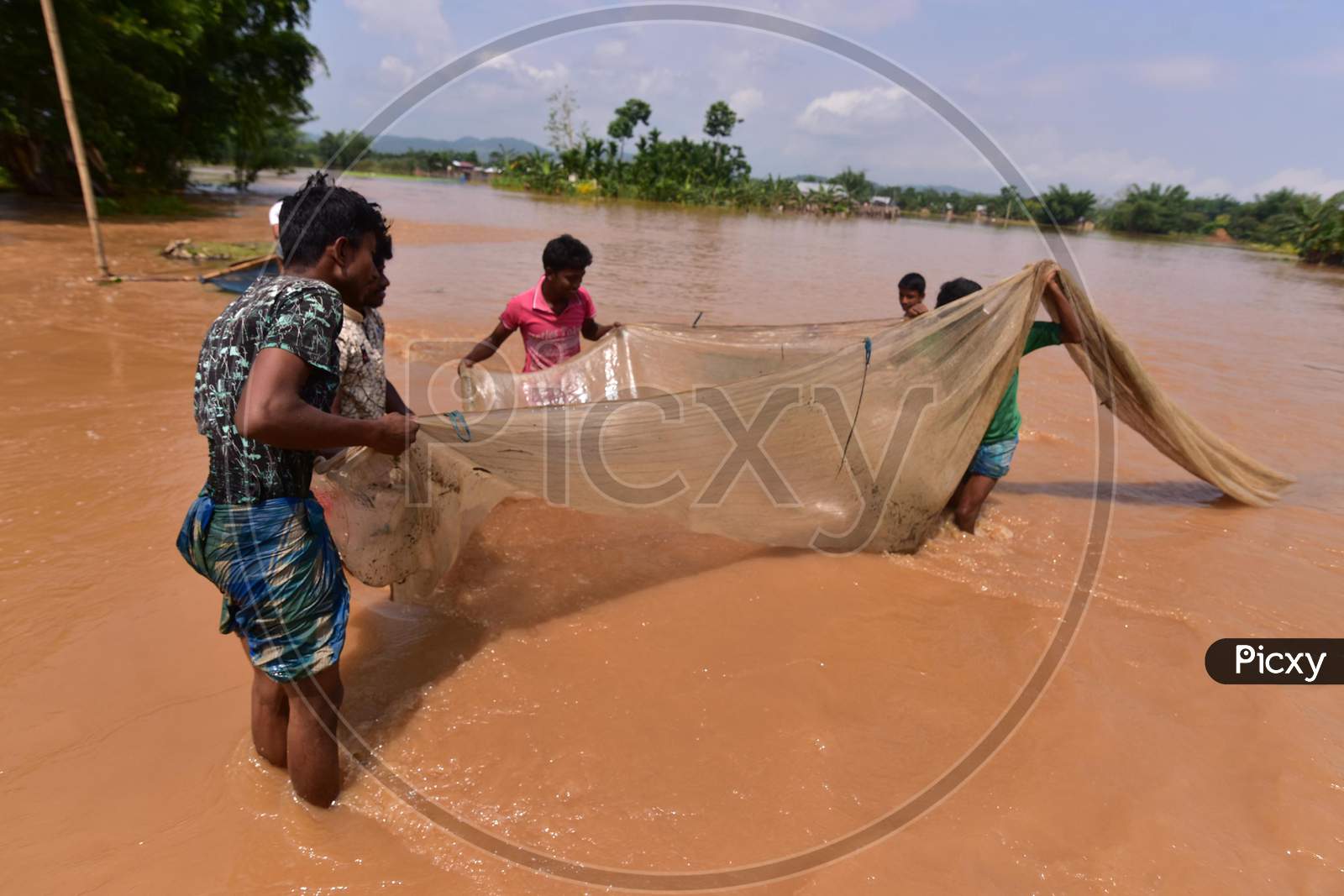 Villagers  Fishing On Flood Water At  Pramila Village Near Kampur In Nagaon District Of Assam On June 7,2020.