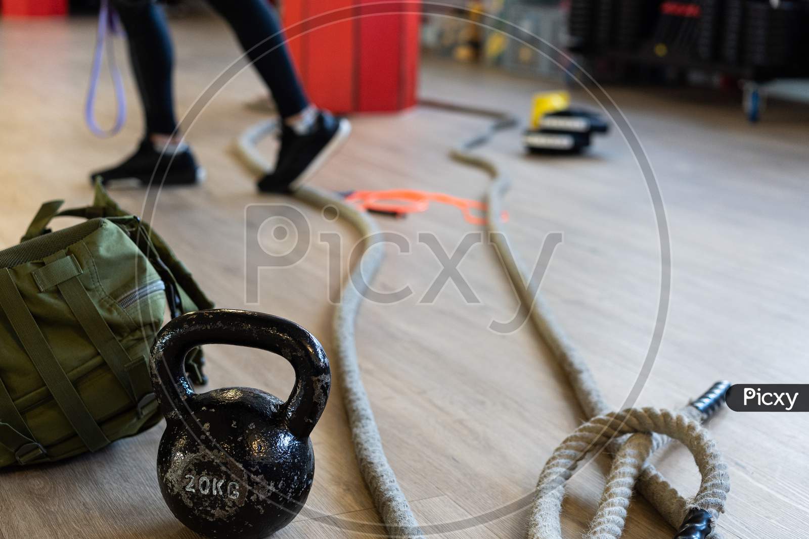 Gym Equipment For Boot Camp And Work Out. Kettle Bell, Rope, Sandbag In Gym Hall.