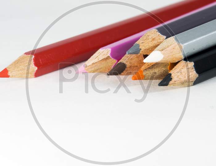 A close view of Group of Colored Pencil in white background for drawing art writing purpose