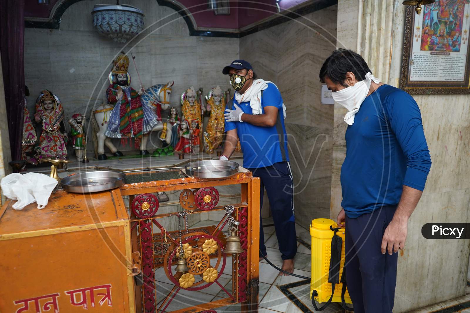 New Delhi, Delhi / India- June 6 2020: People Of Delhi Sanitizing A Temple Using Disinfectant, Corona Virus Update.