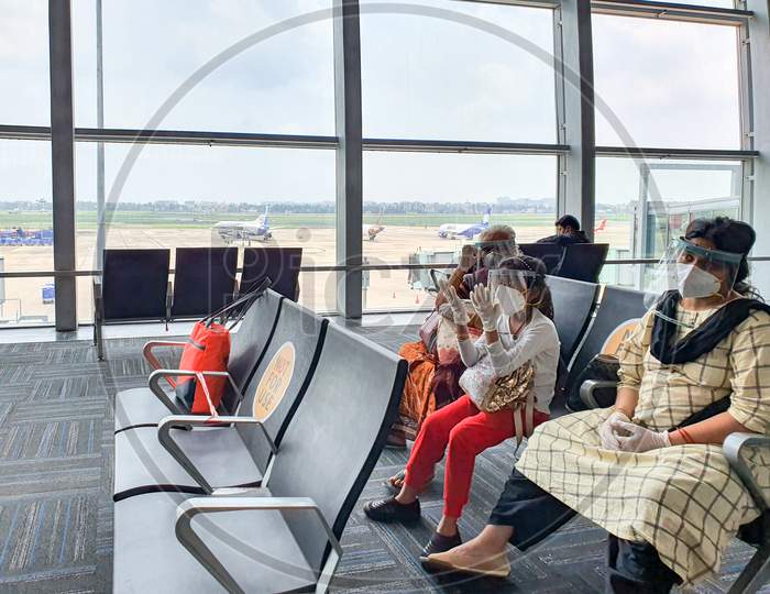 6Th June 2020- Netaji Subhas Chandra Bose International Airport, Calcutta, India-Family Members Maintaing Social Distancing In Protective Gear Before Boarding Flight At Airport