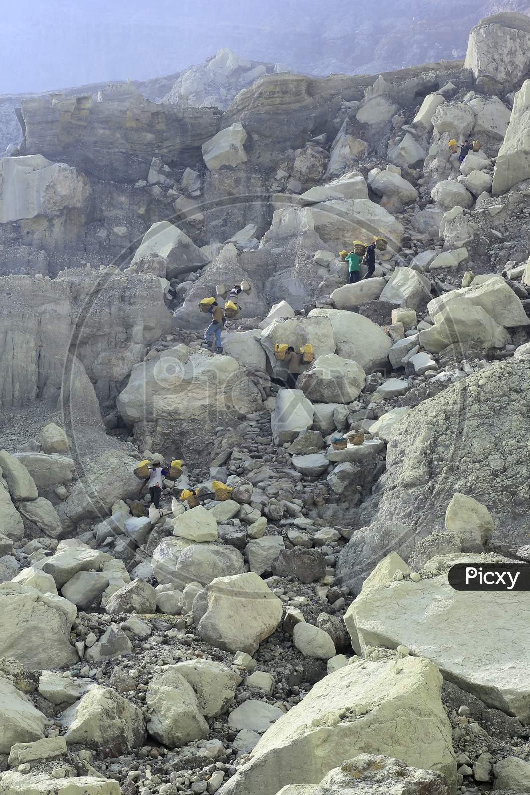 Sulfur miners in the ijen crater