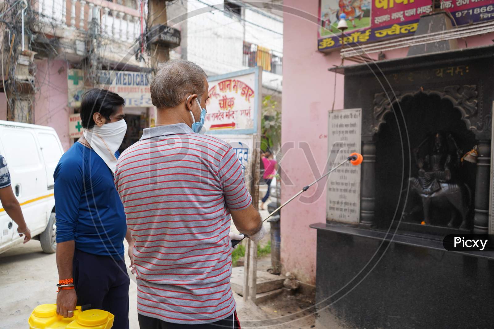 New Delhi, Delhi / India- June 6 2020: People Of Delhi Sanitizing A Temple Using Disinfectant, Corona Virus Update.