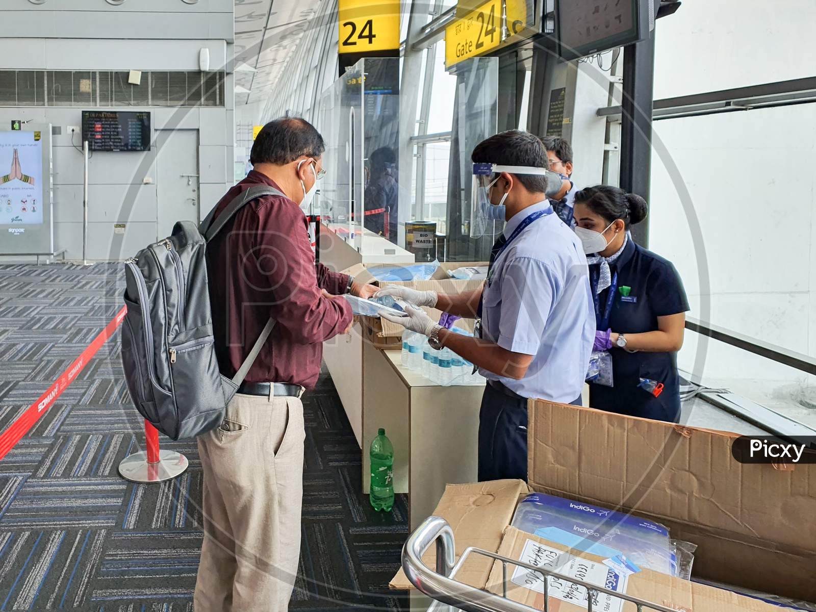 6Th June 2020- Netaji Subhas Chandra Bose International Airport, Calcutta, India-Indigo Airlines Staff Provides Passengers With Personal Protective Equipments Before Boarding Flights