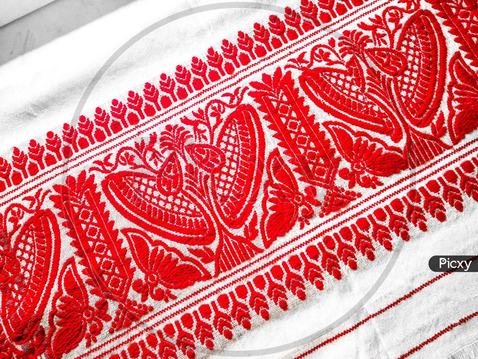 Gamosa (Gamocha/ Gamusa) is a unique identity of Assamese Society. This small piece of cloth with floral design has high esteem and wide usage in Assamese culture.
