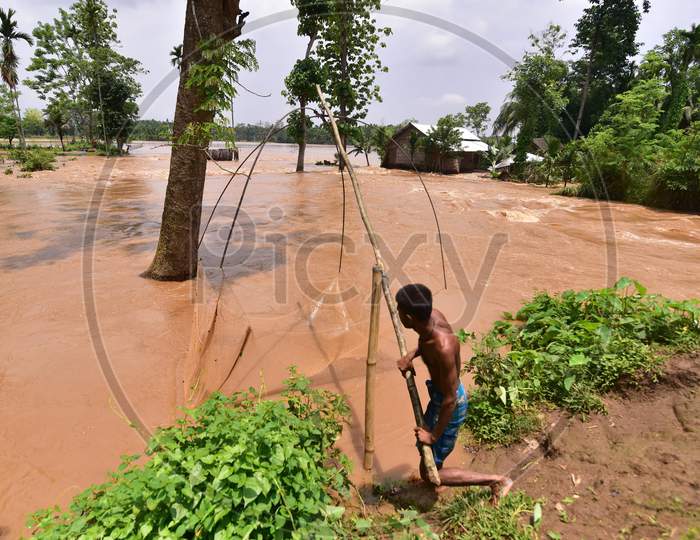 A  Villager Fishing On Flood Water At  Pramila Village Near Kampur In Nagaon District Of Assam On June 7,2020.