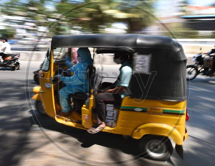 A auto rickshaw Driver Wearing Personal Protective Equipment (Ppe) Drives His Customers in Chennai, Tamil Nadu