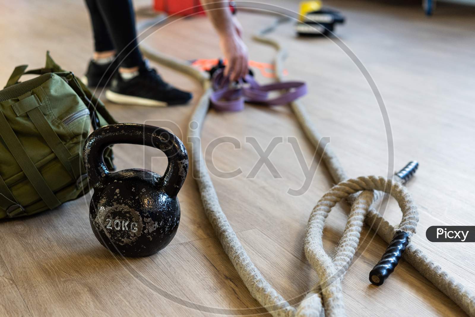 Preparing Gym Equipment For Boot Camp And Work Out. Kettle Bell, Rope, Sandbag In Gym Hall.