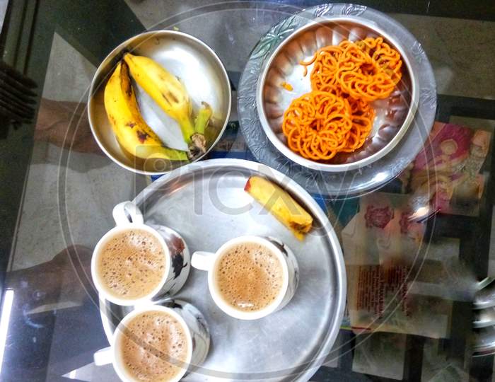 Evening tea with Indian chakkuli ( rice made snacks) and banana