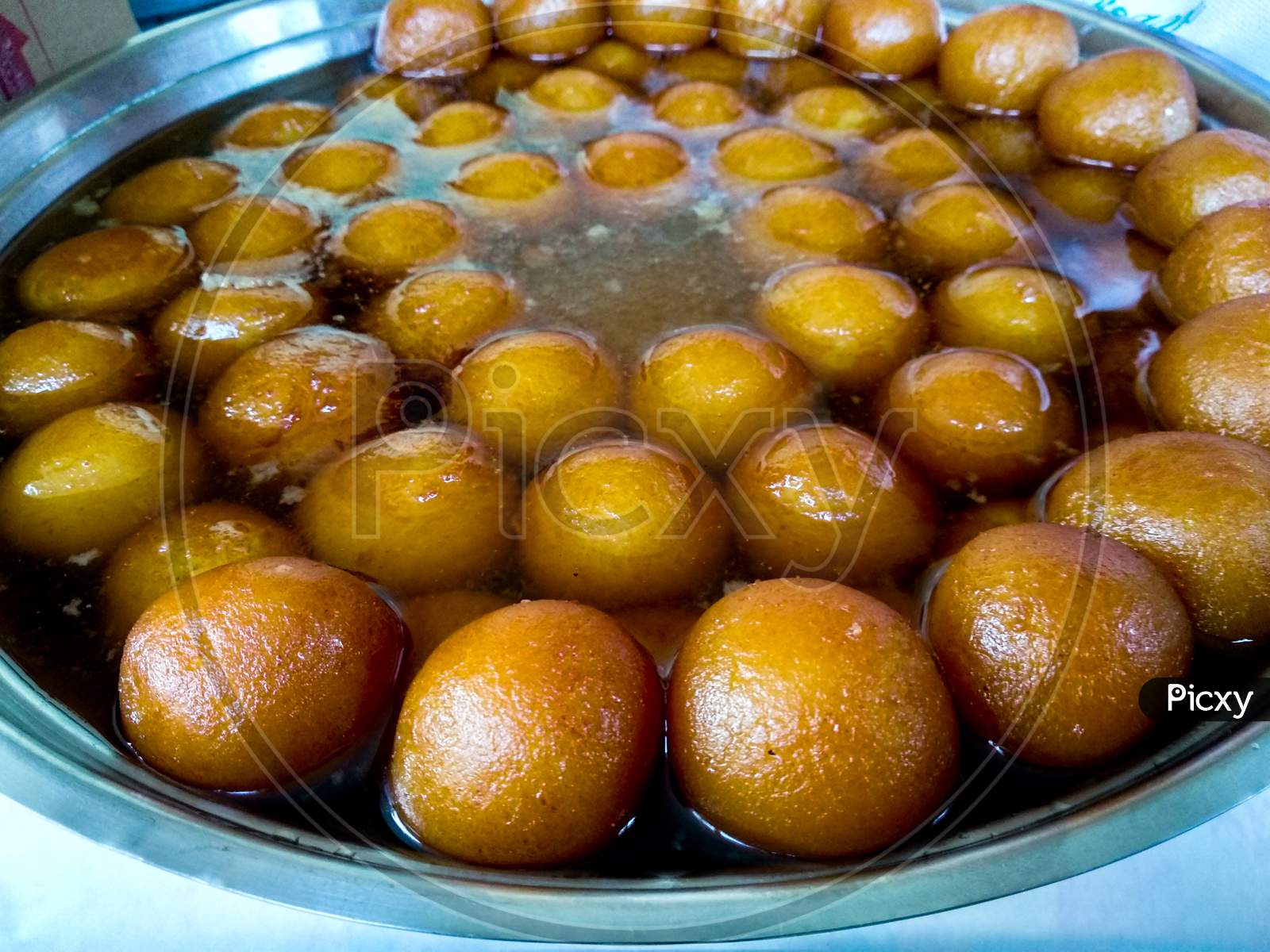Gulab Jamun- Traditional Indian Black colored juicy sweet dish soaked in sugar syrup