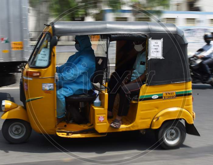 A auto rickshaw Driver Wearing Personal Protective Equipment (Ppe) Drives His Customer in Chennai, Tamil Nadu