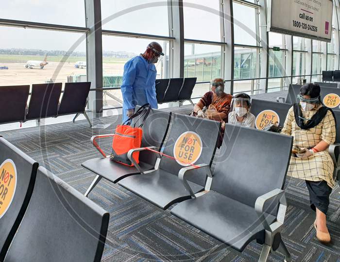 6Th June 2020- Netaji Subhas Chandra Bose International Airport, Calcutta, India-Family Members Maintaing Social Distancing In Protective Gear Before Boarding Flight At Airport
