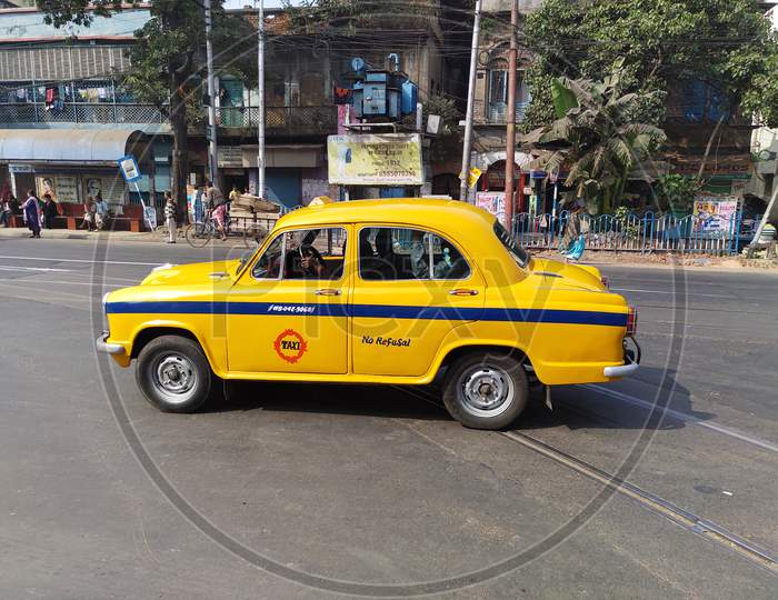 Kolkata, JAN-28 : a yellow colour taxi on the road.