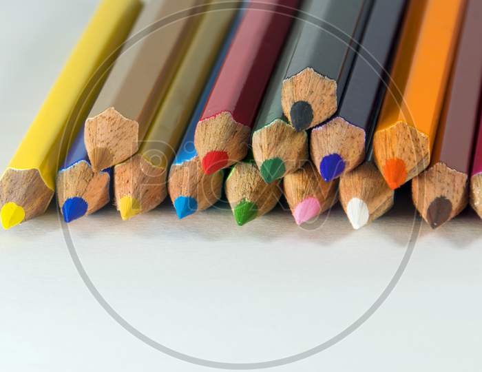 A close view of Group of Colored Pencil in white background for drawing art writing purpose