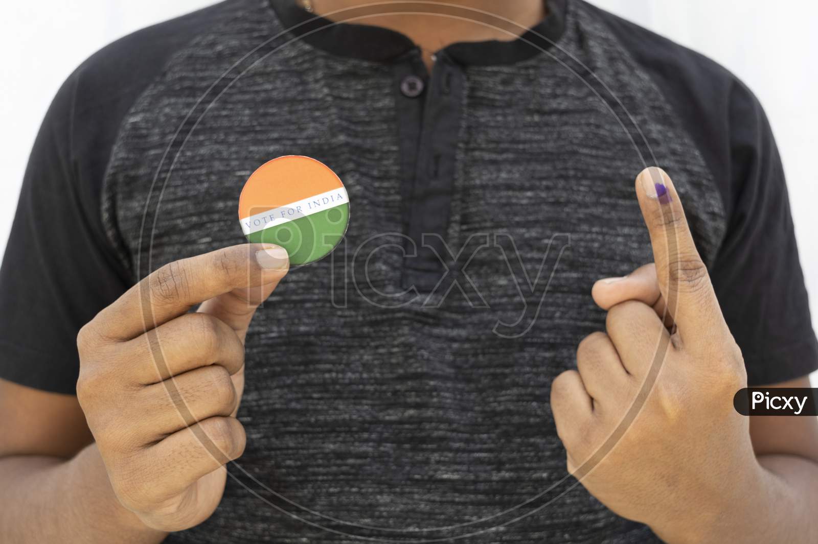 Concept Of Indian Election,Person Holding Sticker Of Vote For Better Indian On Isolated Background.