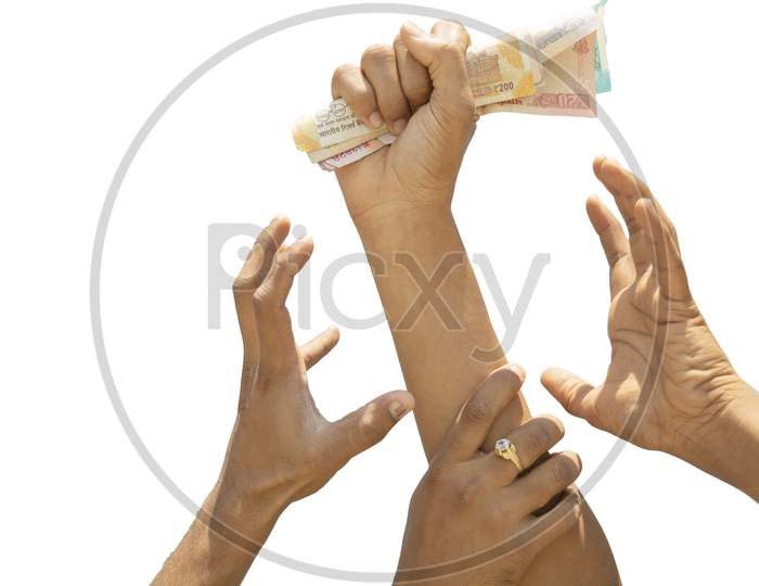 Concept Showing Of Greed For Money, Hands Trying To Grab Money From Another Perosn Hands.