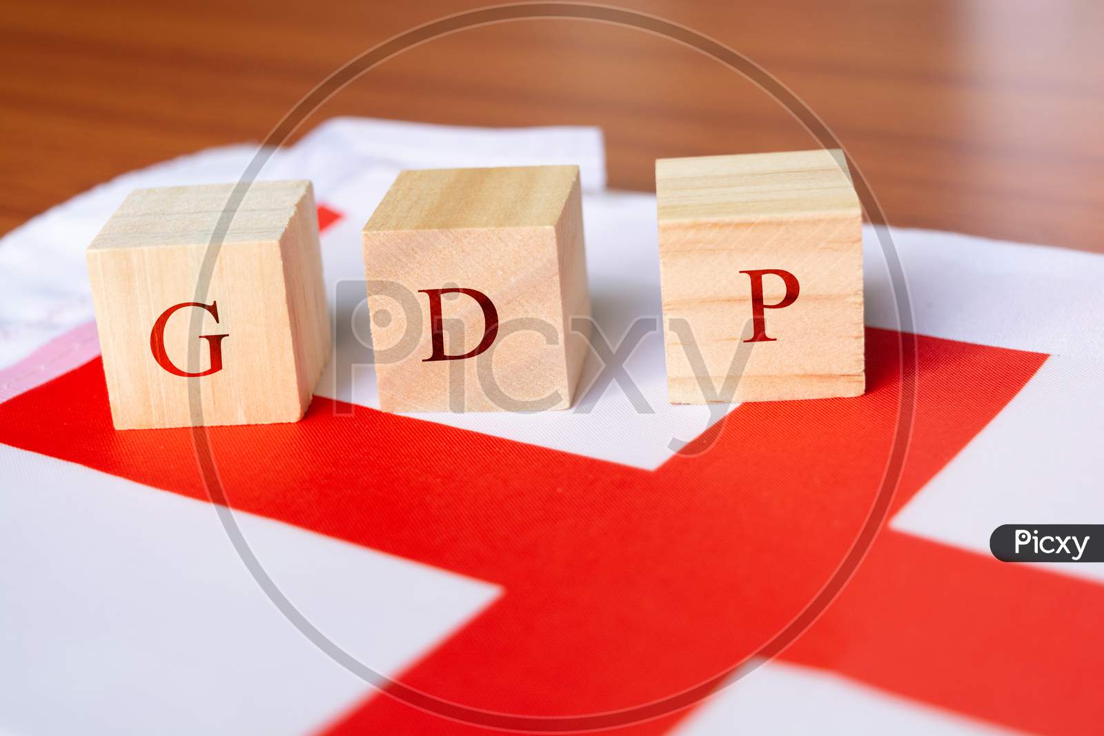 Concept Of Gross Domestic Product Or Gdp Of England, Gdp In Wooden Block Letter with England Flag.