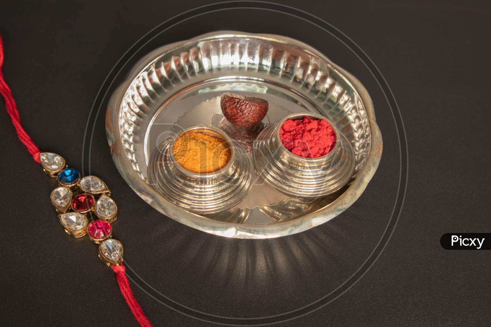 Raksha Bandhan Raakhi Or Rakhi With Pooja Plate A Traditional Hindu Festival Or Ceremony On Black Background,