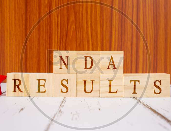 Concept Of Nda Exam Conducted In India For Recruitment, Nda Exam Results On Wooden Block Letters.