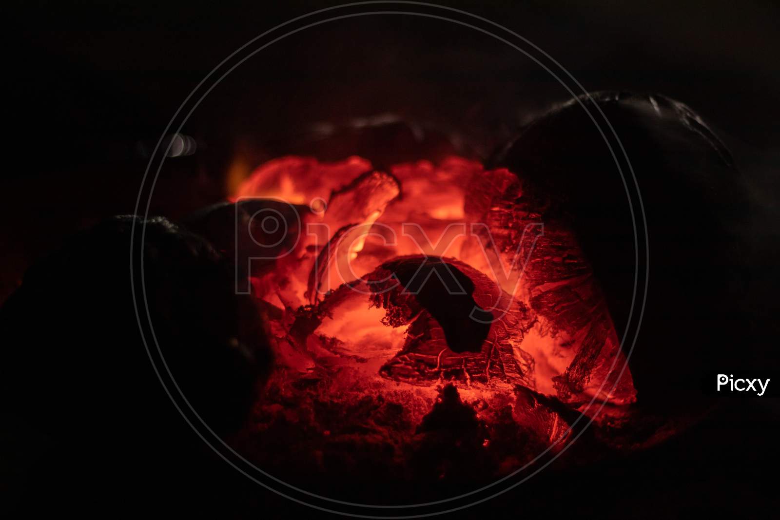 Crest Of Flame On Burning Wood In Fireplace India