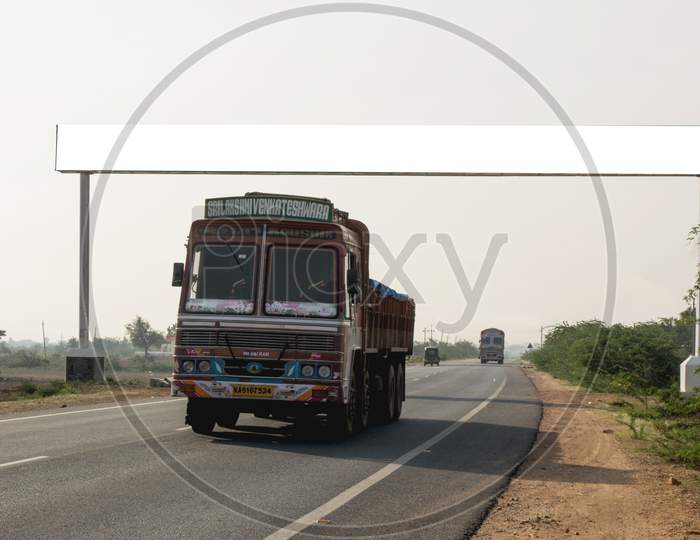 A Loaded Lorry moving on a Single Lane Road