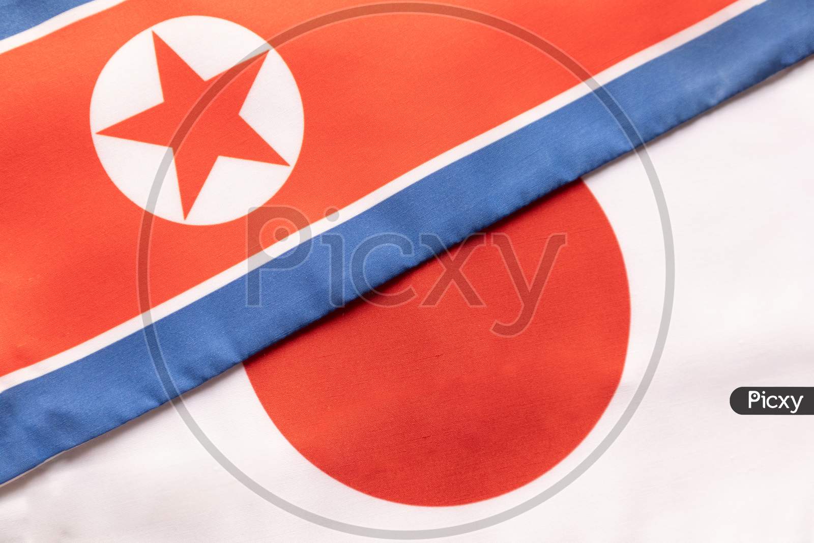 Concept Of Bilateral Relationship Between Japan And North Korea, Showing With Two Flags.