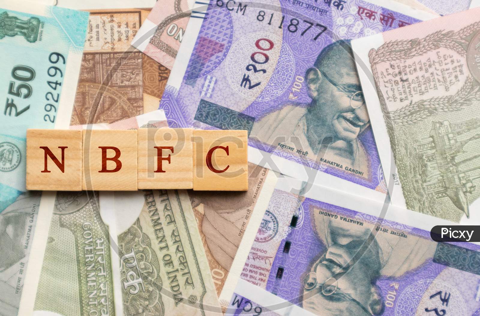 Nbfc In Wooden Block Letters On Indian Currency