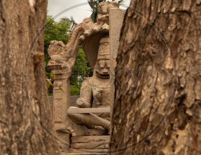 Ugra Narsimha Or Lakshmi Narsimha Captured Through Windows At Hampi. The Man-Lion Avatar Of Lord Vishnu - Seated In A Yoga Position.