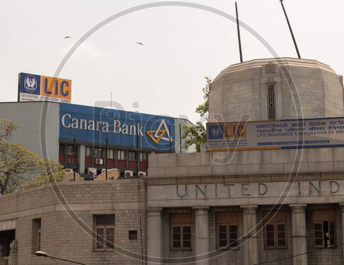 Bangalore, Karnataka India-June 04 2019 : Lic Or Life Insurance Corporation Of India And Canara Bank Billboard On Top The Building At Bengaluru,India