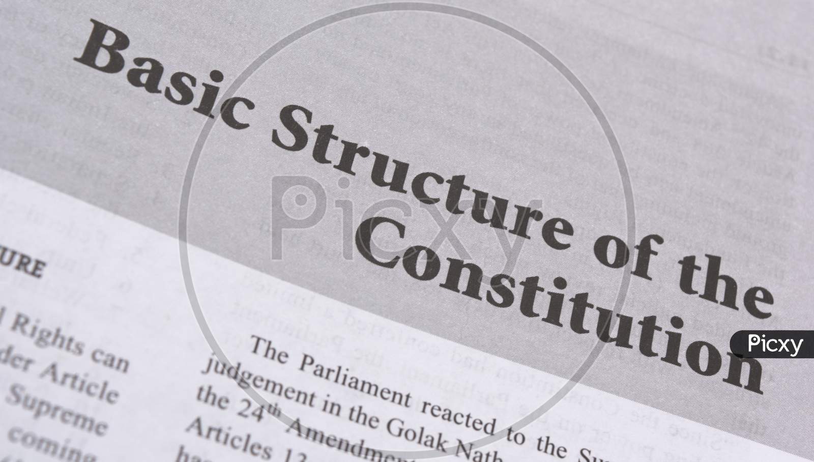 Basic Structure Of The Constitution Printed On Book With Large Letters.