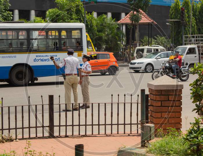 Bangalore, Karnataka India-June 04 2019 :Moving Traffic Near Town Hall Circle And City Traffic Police Busy At Work In Bengalore.
