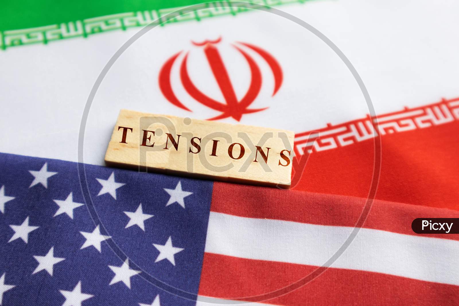 Concept Of Bilateral Relations Of Us And Iran Showing With Flag And War With Wooden Block Letters
