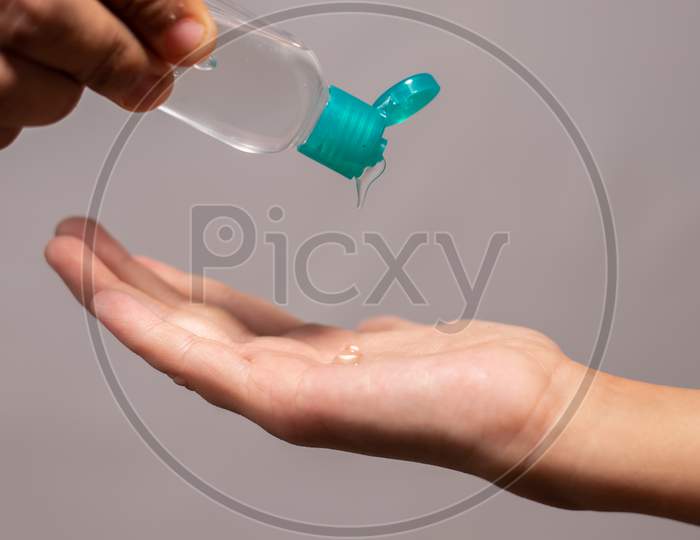 Close up shot of a Person Using Hand Sanitizer Gel, Close Up
