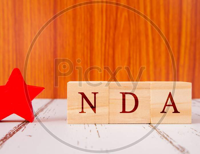 Concept Of Nda Exam Conducted In India For Recruitment On Wooden Block Letters.
