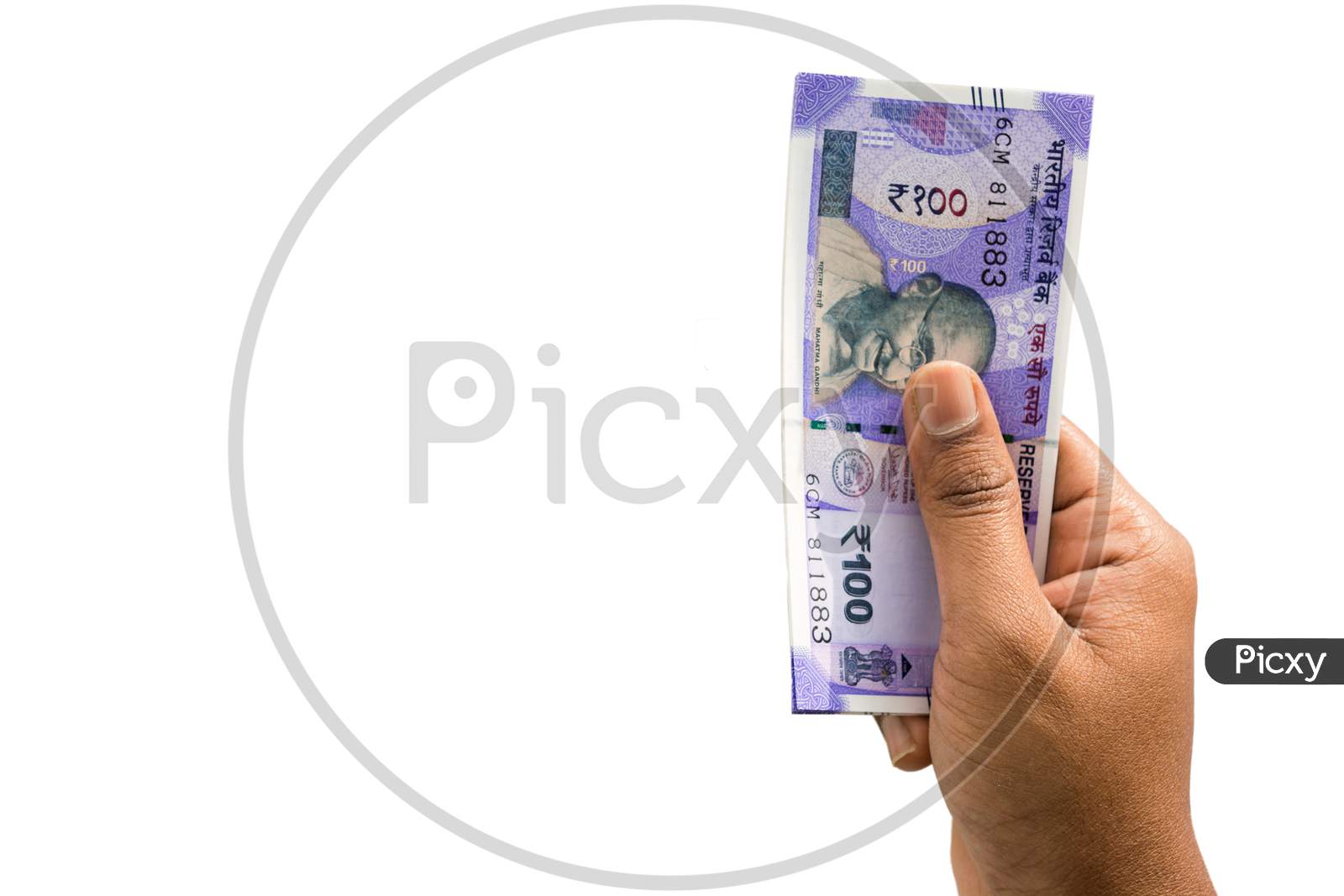 Hand Holding Indian New 100 Rupee Notes On Isolated Background
