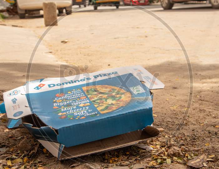 Bengaluru, India June 17, 2019 : Domino'S Pizza Box Thrown Away On The Road Side