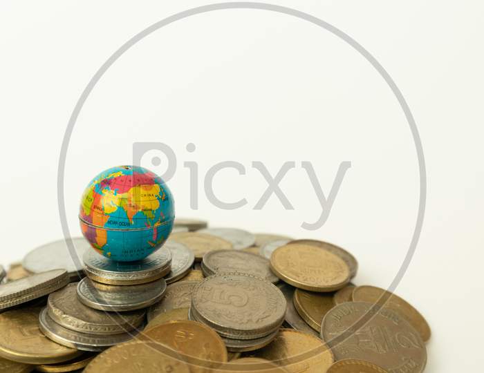 A Globe on Indian Currency Coins